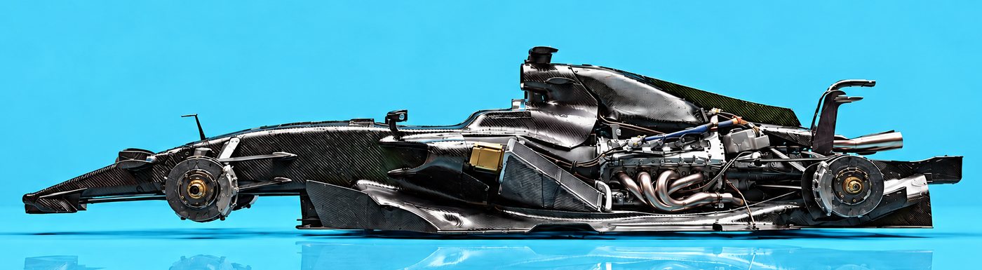 An unfinished race car chassis with five parts of USDZ marked